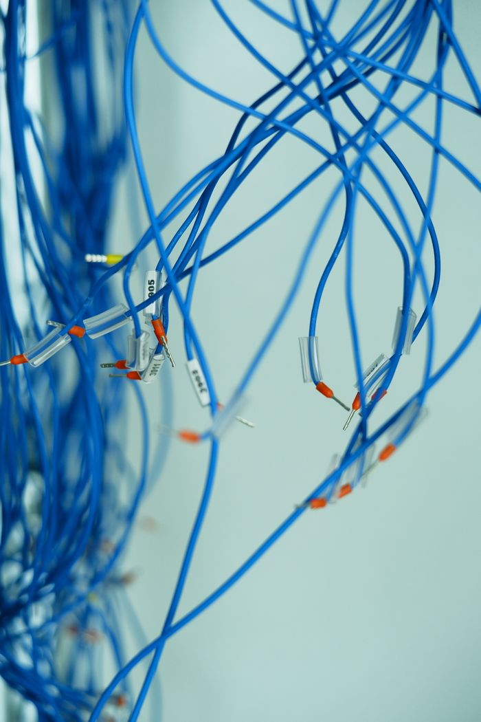 Blue wires with crimped connectors and identification labels