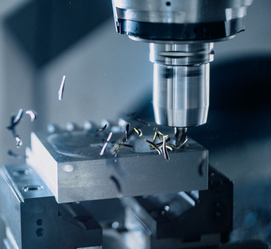 A milling tool machining a metal workpiece